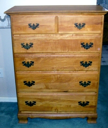 A refinished chest of drawers from a garage sale