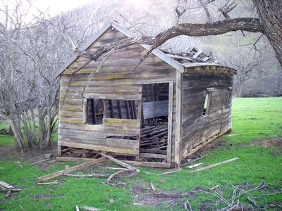 Decaying bunkhouse, typical of what lines the road in